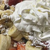Warm Vanilla Custard French Toast · Topped off with fresh fruit and walnuts. Add bacon, ham or sausage for an additional charge.