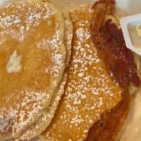 Buttermilk Pancakes · 3 pancakes. Add 2 strips of bacon or 2 sausage links or slice of ham for an additional charge.