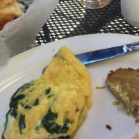 Spinach And Feta Omelette · Three scrambled eggs with sautéed fresh spinach, Greek feta, and hash browns.