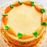 Carrot Cake Slice · Multiple layers of rich, moist carrot cake made with pineapple and walnuts. Topped with smoo...