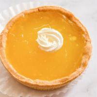 Lemon Tart · A petite tart shell filled with a lemon citrus curd and topped with a brûlée of whipped meri...
