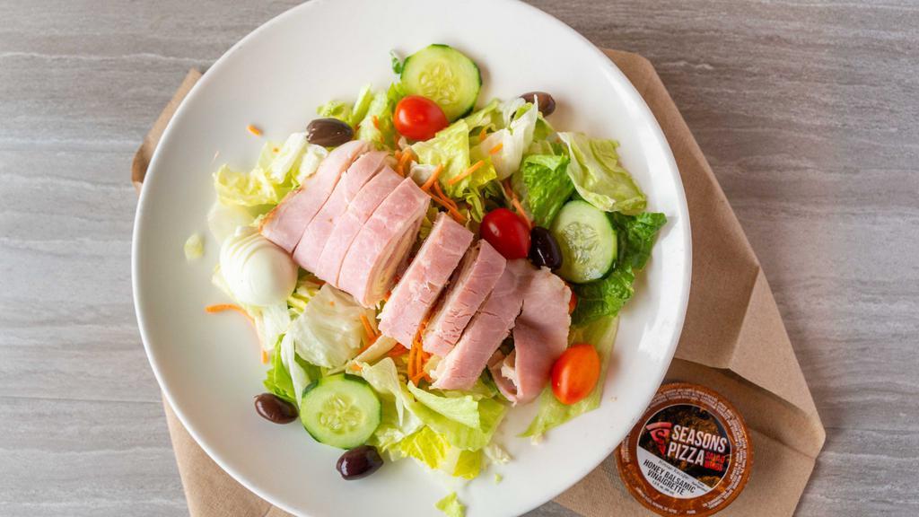 Chef Salad · Ham, turkey, provolone, hard-boiled eggs and Kalamata olives (with pits) over our tossed salad.