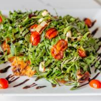 Chicken Milanese · Cutlet topped with arugula, fresh mozzarella, cherry tomatoes, balsamic glaze.