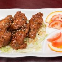 Korean Chicken Wings · Deep fried, crispy, chicken wings in honey sesame sauce