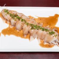 Hamachi Jalapeno. · Yellowtail sashimi, white radish, and jalapeño, glazed with Japanese sauce