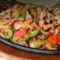 Fajitas Regular (Regular) · Tender sliced grilled steak or chicken on a sizzling hot skillet with bell peppers, onions, ...