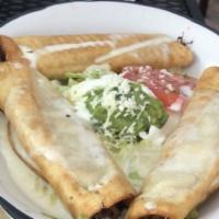 Chicken & Cheese Flautas · Three flour tortillas rolled and filled with marinated chicken, deep fried and then covered ...