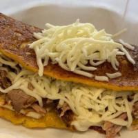 Cachapa With Shredded Beef And Cheese · With shredded beef and cheese.