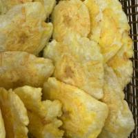 Fried Plantains (Tostones) · Fried plantains slices.