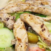 Chicken Kabob Salad. · Greek salad with grilled chicken on it.