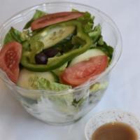 Garden Salad · Crisp romaine lettuce, tomatoes, and cucumbers tossed in our house dressing.