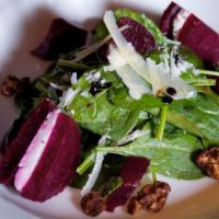 Roasted & Pickled Beets · Spiced walnuts, goat cheese, and raspberry vinaigrette.