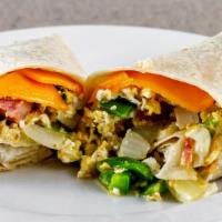 Breakfast Burrito · Two scrambled eggs, bell pepper, sweet onion and your choice of bacon, sausage, ham, linguic...