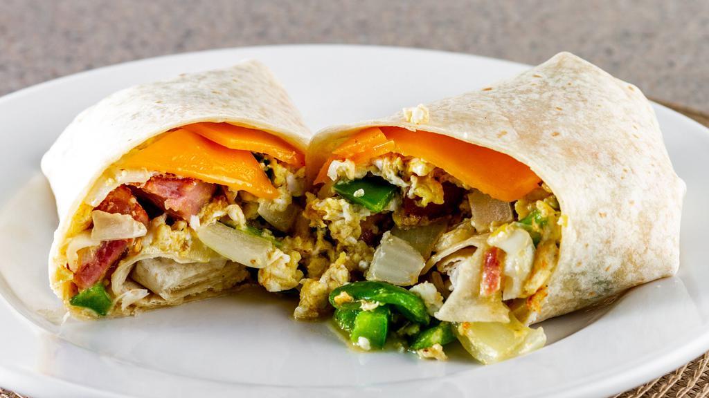 Breakfast Burrito · Two scrambled eggs, bell pepper, sweet onion and your choice of bacon, sausage, ham, linguica or chourico on a flour tortilla.