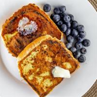 French Toast · Farm fresh eggs whipped until fluffy mixed with cinnamon and maple syrup topped with sweet c...