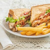 Turkey Club · Made with bacon lettuce tomato and served with french fries.