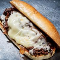 Classic Cheesesteak · Grilled ribeye, smoked gouda cheese sauce or provolone cheese, caramelized onions.