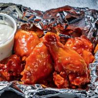 Chicken Wings · Choice of buffalo sauce or spicy dry rub.