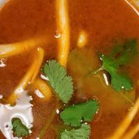 Tom Yum Chicken Soup · Spicy and sour lemongrass soup.