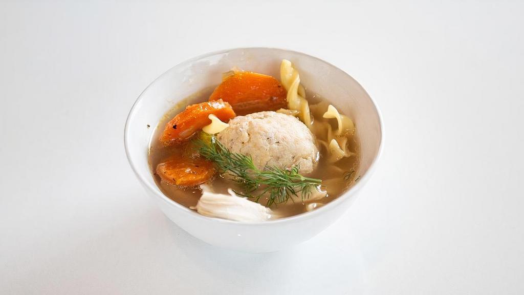 Bi-Partisan Chicken Soup · Our Grandma-style soup that comes with BOTH classic matzah balls AND egg noodles...because if you have to reach across the aisle, it might as well be a soup decision!