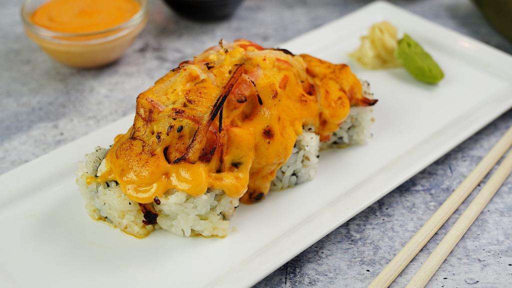 Volcano Roll · Salmon, white fish beep fried top with spicy tuna.