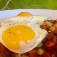 Corned Beef Hash & Eggs · two eggs any style on top of corned beef hash served with toast