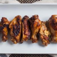 Wings · Choice of spicy buffalo or grilled BBQ, garlic dip or blue cheese.