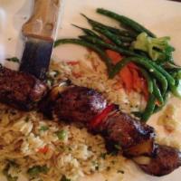 Lamb Kebab · Gluten-free. Marinated prime lamb, peppers, onions, mixed vegetables, rice.
