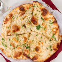 Naan · White bread served with a touch of butter, baked in clay oven.
