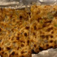 Plain Paratha · Layered unleavened whole wheat flat bread brushed with butter, prepared on Tawa.