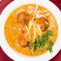 Chicken Vindaloo · Chicken cooked in spiced tangy curry sauce with potatoes.