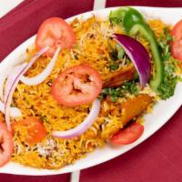 Chicken Biryani · Special imported basmati rice cooked with chicken, onions, fresh ginger and flavored with de...