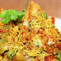 Samosa Chaat · Crushed potato turnover with chickpea and spices.