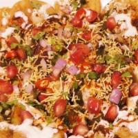Aloo Papri Chaat · Crunchy flour wafer mixed with chickpeas, onions, and potato.