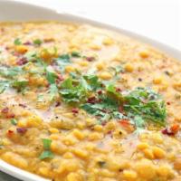 Daal Tadka · Vegan, gluten-free. Yellow lentil tempered with Indian spices and tomatoes, Indian herbs and...