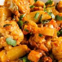 Aloo Gobi · Vegan, gluten-free. Steamed cauliflower with potatoes and tomatoes, flavored with Indian her...