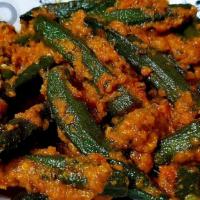 Bhindi Masala · Vegan, gluten-free. Stir-fried okra with tomato seasoning and stir-fried onions.