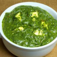 Palak Paneer · Fresh spinach with homemade cheese cubes cooked in mild spices and herbs.