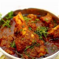 Lamb Curry · Gluten-free. Chunks of tender lamb cooked in thick curry sauce.