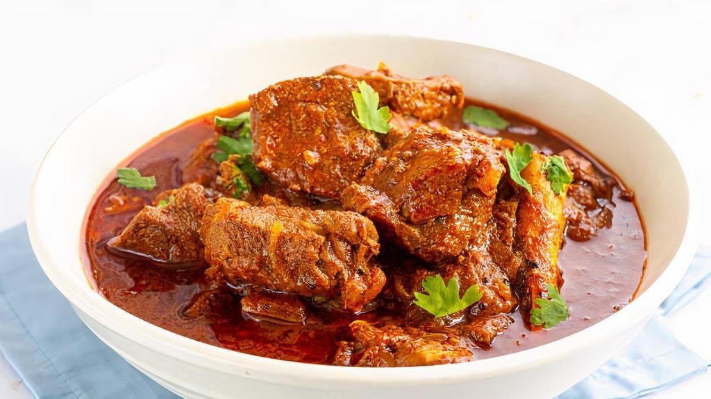 Lamb Vindaloo · Gluten-free. Highly spiced Southern Indian specialty lamb cooked in spicy and tangy sauce with potatoes. Spicy.