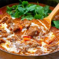 Coconut Lamb Curry · Gluten-free. Boneless lamb cubes cooked with coconut milk, onion, and tomato sauce.