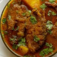 Fish Vindaloo · Gluten free, spicy. Gluten-free. Cat fish cooked in a spicy and tangy sauce with potatoes.
