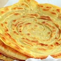 Lachha Paratha · Made with whole wheat flour. Multilayered whole wheat bread topped with butter.