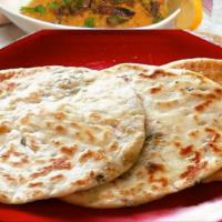 Aloo Kulcha · Made with all-purpose white flour. Naan bread filled with mildly spiced tomatoes.