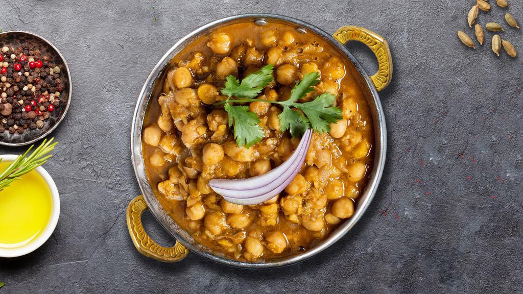 Chana Masala · Chickpeas cooked in a tomato and onion gravy with Indian spices.