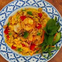 Pineapple Fried Rice · Combination of shrimp and chicken, stir-fried with egg, pineapple, tomatoes, carrot, onion, ...
