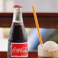 Coke Float · Coke with vanilla ice cream.