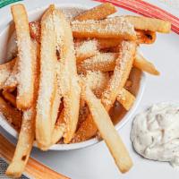 Truffle Fries · Fries dusted with salt, pepper, Parmesan cheese & a drizzle of white truffle oil. Served wit...
