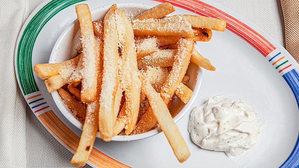 Truffle Fries · Fries dusted with salt, pepper, parmesan cheese, white truffle oil drizzle, and served with truffle aioli sauce.