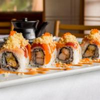 Crazy Roll · Shrimp tempura, salmon, tuna, yellowtail, crabmeat, crunch, spicy sauce, and masago.